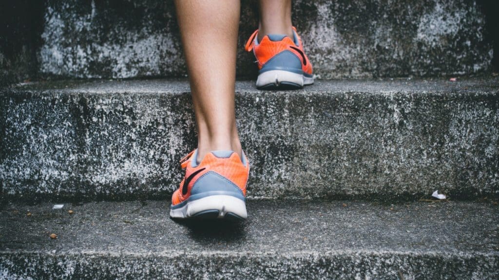 Close-up of someone walking up some steps